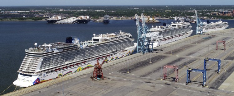 Norwegian cruise ships are docked at Portsmouth Marine Terminal in Portsmouth, Va. in May 2020.  Norwegian Cruise Line asked a federal judge Friday to block a Florida law prohibiting cruise companies from demanding that passengers show written proof of coronavirus vaccination before they board a ship. 
