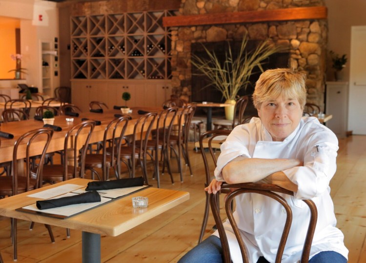 KENNEBUNK, ME - AUGUST 10: Rebecca Charles poses for a portrait in the dining room of her Kennebunk restaurant Pearl on Thursday, August 10, 2017. Charles was a New York chef with deep roots in Maine who had long dreamed of opening a restaurant here. Last fall she opened a little café called Spat Oyster Cellar and she planned to renovate the upstairs main dining room over the winter and open the full restaurant this summer. She poured all of her life savings into it. Her dream became a nightmare when, late last February, she got a call saying the sprinkler system had burst in her restaurant. (Staff Photo by Gregory Rec/Staff Photographer)