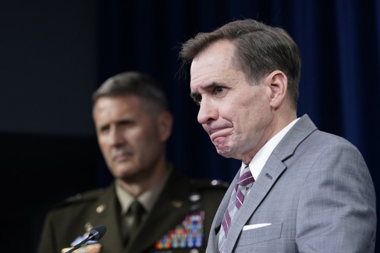 Pentagon spokesman John Kirby, right, and Army Maj. Gen. William "Hank" Taylor, left, listen to questions during a briefing at the Pentagon in Washington on Saturday.