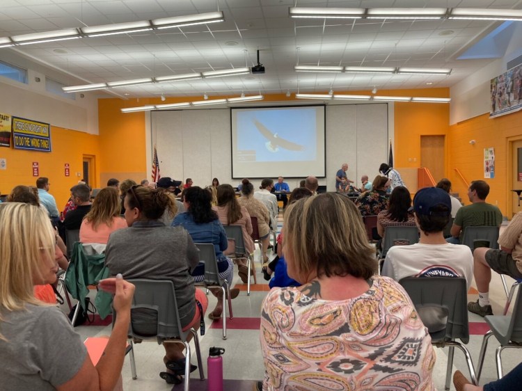 Parents, teachers and students gather Wednesday night at Messalonskee Middle School in Oakland to discuss the school district's reopening plan. 