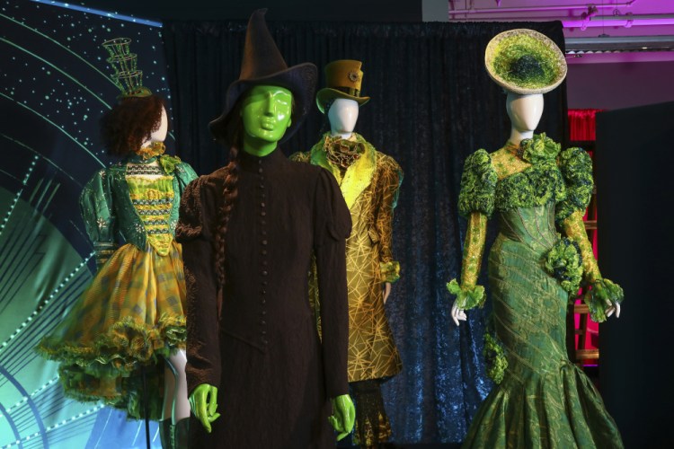 Costumes from the Broadway musical "Wicked" are displayed at the "Showstoppers! Spectacular Costumes from Stage & Screen" exhibit, benefiting the Costume Industry Coalition Recovery Fund, in Times Square on Monday in New York. 