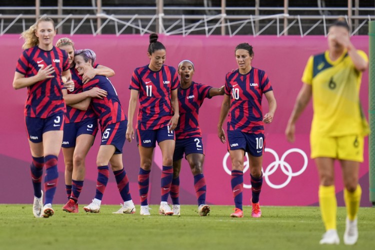 United States' Megan Rapinoe celebrates with teammates scoring her side's 2nd goal against Australia in the women's bronze medal soccer match.