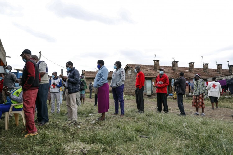 Kenyans queue to receive the AstraZeneca coronavirus vaccine donated by Britain in Nairobi on Saturday.