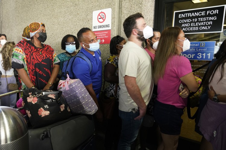 Passengers wait to get a COVID-19 test to travel overseas at Fort Lauderdale-Hollywood International Airport in Florida on Friday.


