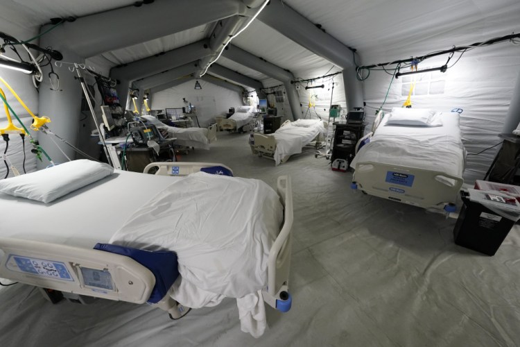 Five intensive care beds, part of the 32-bed Samaritan's Purse Emergency Field Hospital, are set up in one of the University of Mississippi Medical Center's parking garages, Tuesday, Aug. 17, 2021, in Jackson, Miss. 