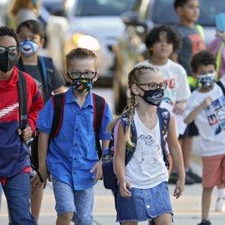 Virus Outbreak School Masks