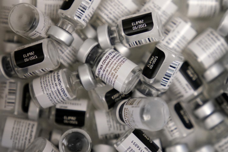 Used vials of the Pfizer-BioNTech COVID-19 vaccine lay empty at a vaccination center at the University of Nevada in Las Vegas in January.