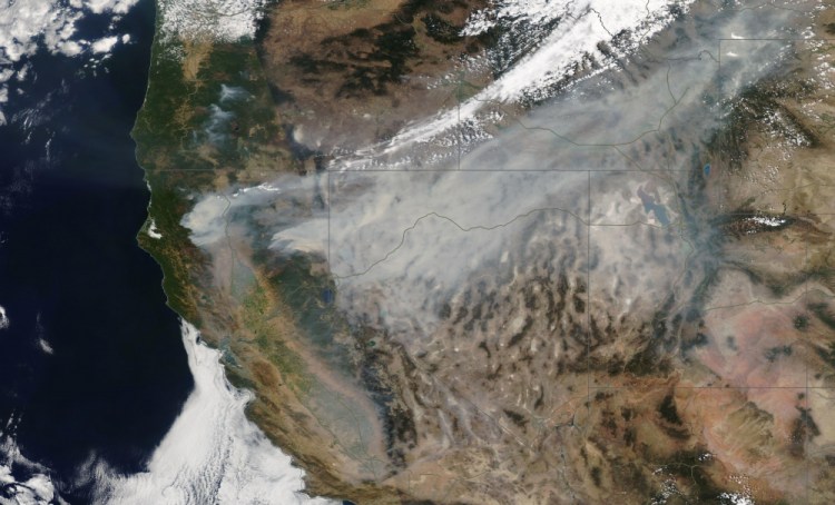 In this satellite image provided by Maxar Technologies the Dixie Fire burns in Northern California on Sunday, Aug. 8, 2021.
