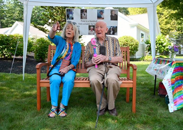 TOPSHAM, ME - AUGUST 12: Nancy and Peter Kaye sit on the bench that Nancy had installed along Peter's daily walking route at the Highlands, a retirement community where they live in Topsham Thursday, August 12, 2021. (Staff Photo by Shawn Patrick Ouellette/Staff Photographer)