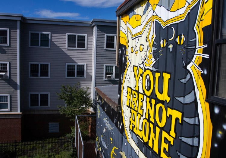 PORTLAND, ME - SEPTEMBER 2: After the building at 82 Gilman Street was tagged with graffiti in March, owner Fraser Jones decided to hire local artist Kerrin Parkinson to create a mural that helps spread awareness of mental health initiatives. (Davis/Staff Photographer)