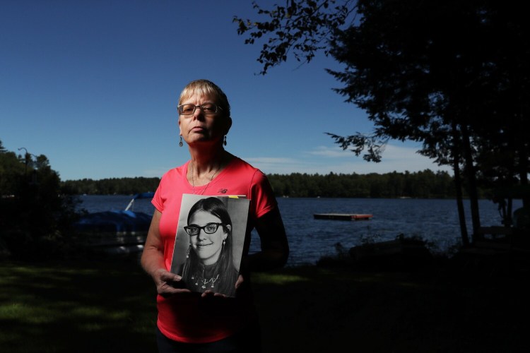 WINDHAM, ME - SEPTEMBER 16: Kim Higgins, holds a photo of her older sister, Cathy Moulton, who went missing from Forest Avenue in Portland on Sept. 24, 1971. Police believe she left Portland with her boyfriend, was held against her will and ultimately died on a reservation in New Brunswick. Her body has never been found and no one has been charged in her disappearance. (Staff photo by Ben McCanna/Staff Photographer)