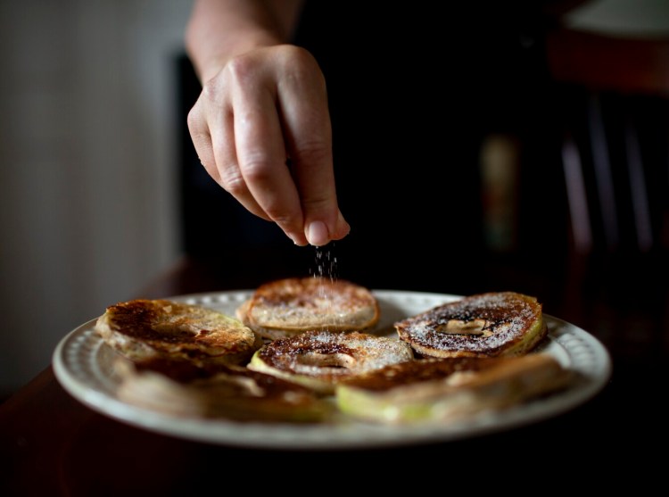 Sprinkle the Boiled Cider Apple Pancakes with cinnamon-sugar.