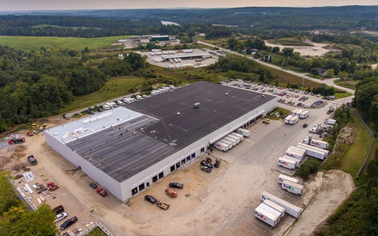 Construction is well under way for a $1 million, 35, 388-square foot expansion, left, of the FedEx distribution facility at 380 River Road in Lewiston as seen in this aerial photo taken Wednesday afternoon. River Road can be seen middle left as well as Estes Express Lines, and the Solid Waste Facility, background.