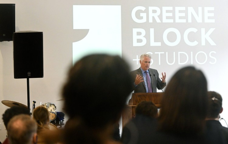 Colby College President David Greene addresses the audience Tuesday during the Greene Block + Studios ribbon-cutting ceremony at the college's $6.7 million arts collaborative building in downtown Waterville.