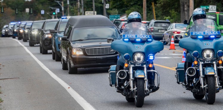 AUGUSTA, ME - SEPTEMBER 23: The hearse carrying the body of Hancock County Deputy Luke Gross is about to turn  Thursday September 23, 2021 off Hospital Street and into the Office of the Chief Medical Examiner in Augusta. (Staff photo by Joe Phelan/Staff Photographer)