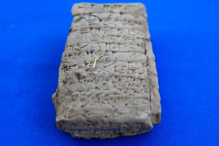 An inchworm crawls on an ancient cuneiform tablet from Iraq during a ceremony returning ancient objects to Iraq by Immigration and Customs Enforcement (ICE), at the Residence of the Iraqi Ambassador to the United States, in Washington, Wednesday, May 2, 2018. The artifacts were smuggled into the United States in violation of federal law and shipped to Hobby Lobby stores, a nationwide arts-and-crafts retailer. The items include cuneiform tablets, cylinder seals, and clay bullae. 