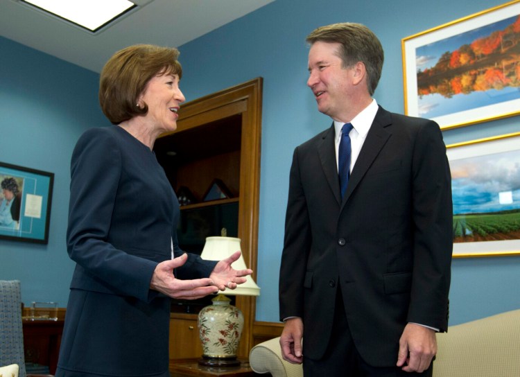 U.S. Sen. Susan Collins, R-Maine, speaks with then Supreme Court nominee Judge Brett Kavanaugh at her office in August 2018. Hers was a crucial vote for his appointment.