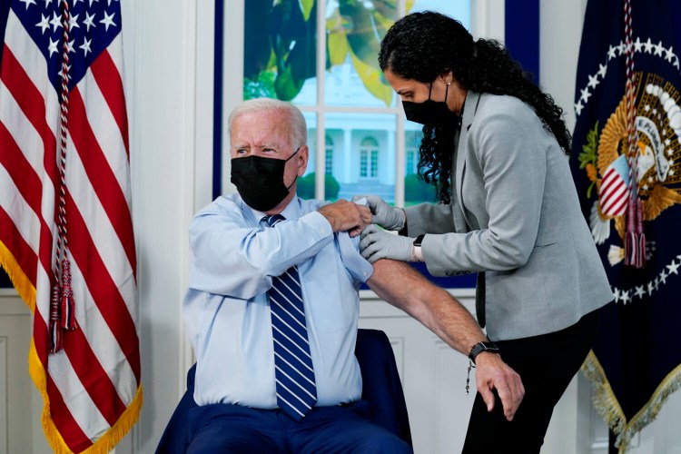 President Joe Biden receives a COVID-19 booster shot during an event in the South Court Auditorium on the White House campus, Monday, Sept. 27, 2021, in Washington. (AP Photo/Evan Vucci)