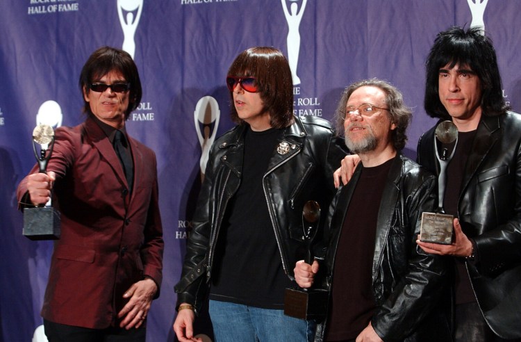 FILE - In this March 18, 2002, file photo, members of the Ramones, from left to right, Dee Dee, Johnny, Tommy and Marky Ramone hold their awards after being inducted at the Rock and Roll Hall of Fame induction ceremony at New York's Waldorf Astoria. A business associate says Tommy, the last surviving member of the original group, has died. Dave Frey, who works for Ramones Productions and Silent Partner Management, confirmed that he died on Friday, July 11, 2014. Ramone was 65. (AP Photo/Ed Betz, File)