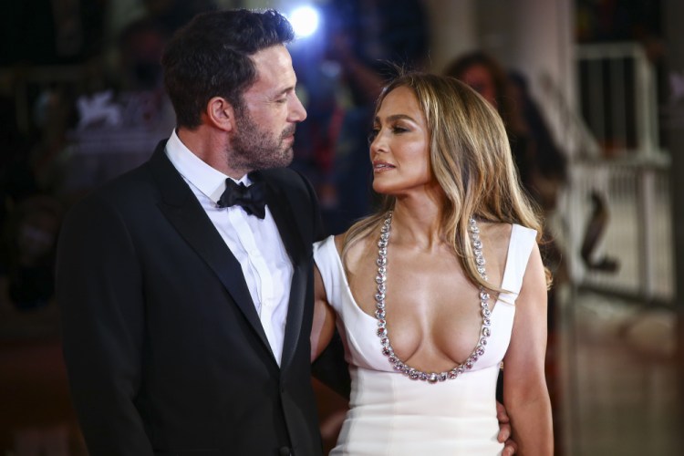 Jennifer Lopez, right, and Ben Affleck pose for photographers upon arrival at the premiere of the film 'The Last Duel' Friday during the 78th edition of the Venice Film Festival in Venice.