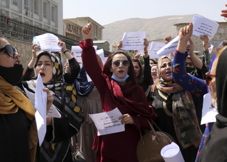 Women gather to demand their rights under the Taliban rule during a protest in Kabul on Friday, Sept. 3.