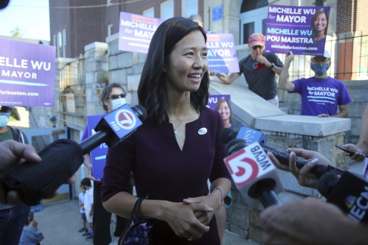 Boston mayoral candidate Michelle Wu speaks with the media after casting her ballot in the mayoral race Tuesday at Phineas Bates Elementary School. 