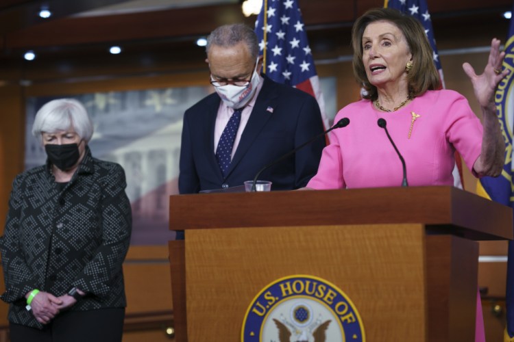 Speaker of the House Nancy Pelosi, D-Calif., right, Treasury Secretary Janet Yellen, left, and Senate Majority Leader Chuck Schumer, D-N.Y., update reporters on Democratic efforts to pass President Biden's "Build Back Better" agenda, at the Capitol in Washington on Thursday. 