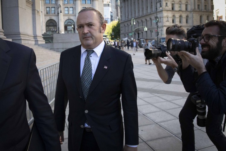 Igor Fruman, left, arrives for his arraignment in New York in 2019. U.S. plans for Fruman, who assisted Rudy Giuliani in seeking damaging information about Joe Biden in Ukraine when Biden was running for president and Giuliani was serving as a personal attorney to then-President Donald Trump, to plead guilty in an illegal campaign contribution case are being delayed a few weeks, a court filing said Aug. 24. A filing Tuesday said the change-of-plea proceeding will now take place Sept. 10 at the request of Fruman's lawyer. 


