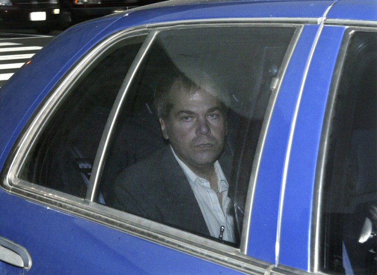 John Hinckley Jr. arrives at U.S. District Court in Washington in 2003. Lawyers for Hinckley, the man who tried to assassinate President Ronald Reagan, are scheduled to argue in court Monday that the 66-year-old should be freed from restrictions placed on him after he moved out of a Washington hospital in 2016.