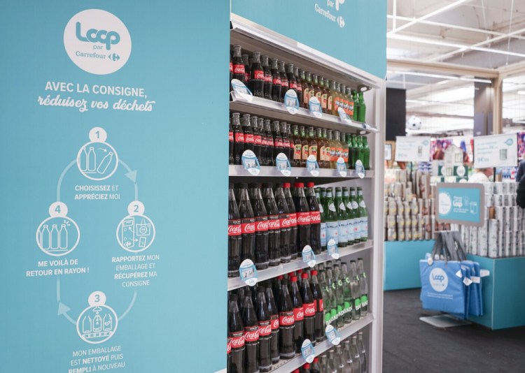 Loop reusable packaging is displayed at French supermarket.  Reusable packaging is about to become more common at groceries and restaurants worldwide. 