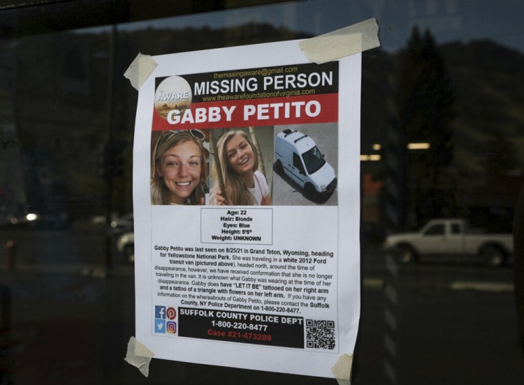 A Suffolk County Police Department missing person poster for Gabby Petito is posted in Jackson, Wyo. Petito, 22, vanished while on a cross-country trip in a converted camper van with her boyfriend. Authorities discovered her body Sunday in Wyoming. 