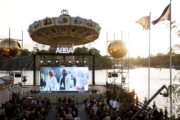 People look at the screen, at the ABBA Voyage event at Grona Lund, in Stockholm, Sweden, Thursday.