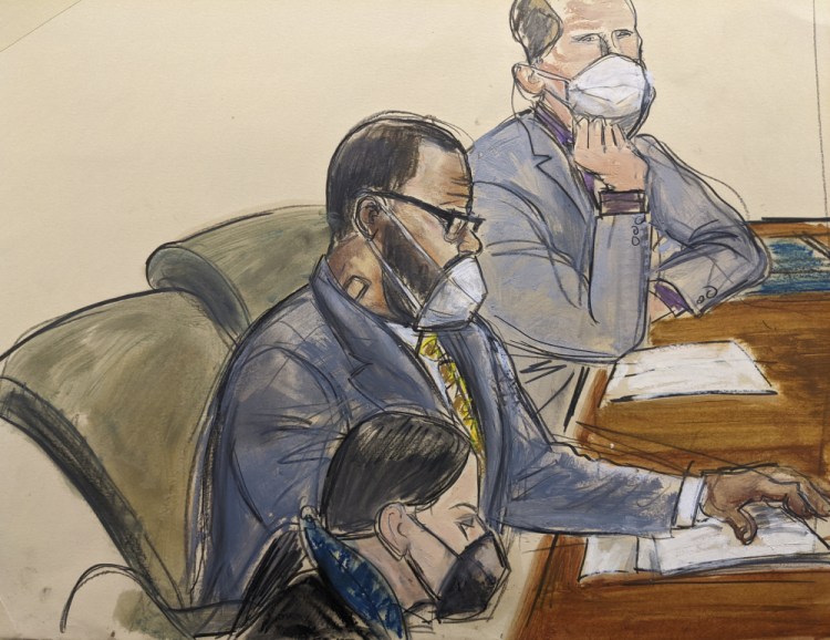 In this courtroom sketch, R. Kelly, center, sits with his defense attorneys Thomas Farinella, top, and Nicole Blank Becker during the first day of his defense in his sex trafficking case, Monday in New York.