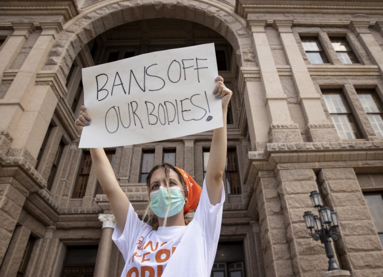 Jillian Dworin participates in a protest against the six-week abortion ban at the Capitol in Austin, Texas, this month. A poll finds that 54 percent of Americans say they disagree with the U.S. Supreme Court's decision to let the law stand while the legal battle over it continues.
