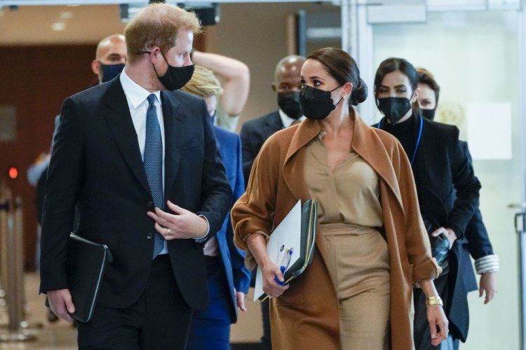 Prince Harry and Meghan, the Duke and Duchess of Sussex, are escorted as they leave the United Nations headquarters after a visit during 76th session of the United Nations General Assembly on Saturday.