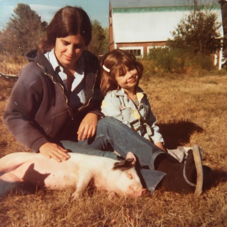 At Sunshine Farm in Litchfield in 1978, 5-year-old Avery Yale Kamila sits next to her mother, Terry Yale, who is patting Fifi. 