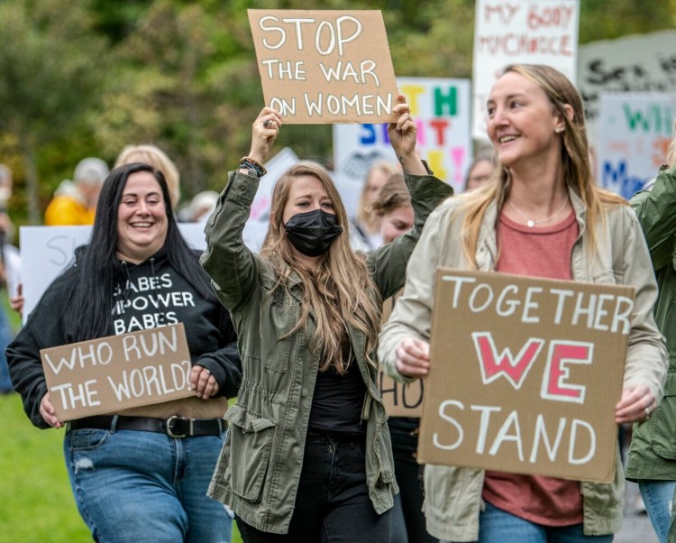 BELGRADE, ME - OCTOBER 2: People march around the village green during rally for womenÕs rights Saturday October 2, 2021 in Belgrade Lakes. (Staff photo by Joe Phelan/Staff Photographer)