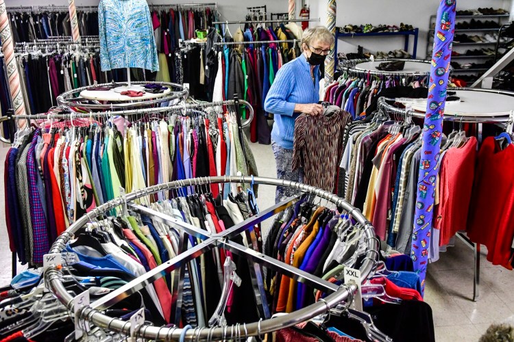 GARDINER, ME - SEPTEMBER 30: Judy Harriman straightens out items in the racks Thursday September 30, 2021 at The Clothes Closet in Gardiner. (Staff photo by Joe Phelan/Staff Photographer)