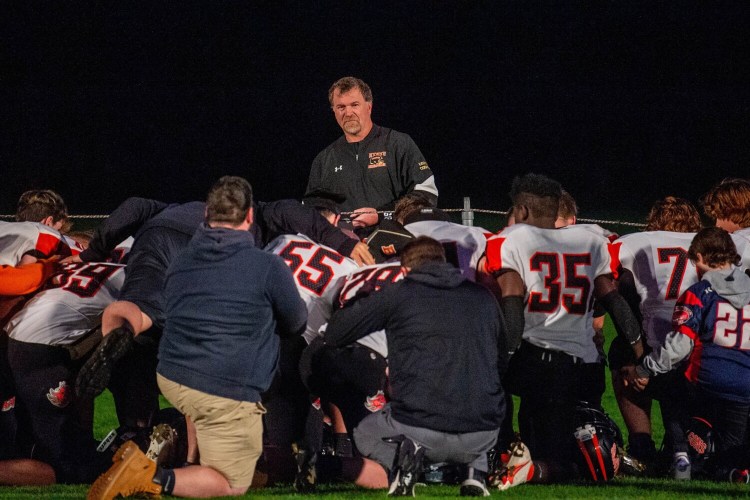 SKOWHEGAN, MAINE- OCTOBER 1, 2021
Brunswick High School kneels in the end zone astray prepare to face Skowhegan High School at Skowhegan High School on Friday,Oct. 1, 2021. (Staff Photo by Michael G. Seamans/Staff Photographer)