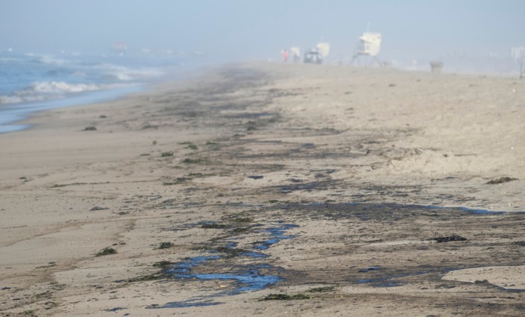 Oil washed up on Huntington Beach, Calif., on Sunday. At least 126,000 gallons of crude spilled into the waters off Orange County.
