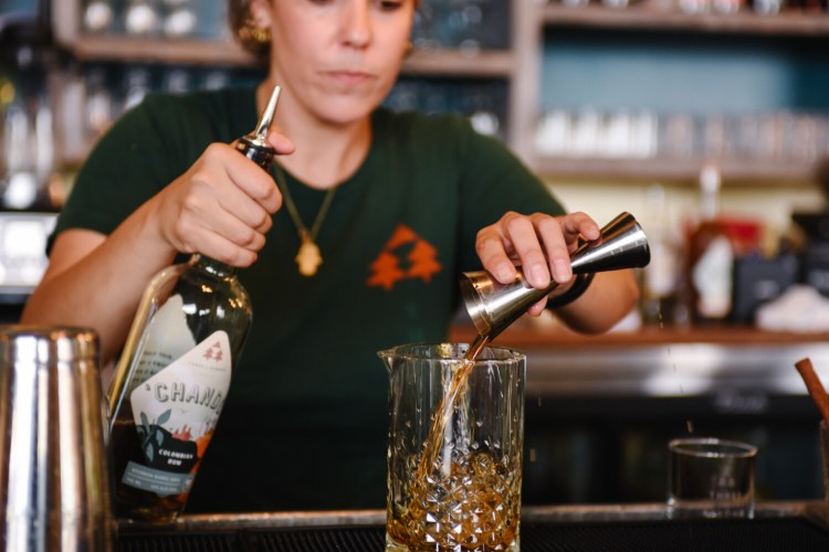 Rachel MacArthur, lead bartender at Three of Strong in Portland, mixes a rum cocktail. She'll be teaching a class in mixing rum cocktails during Harvest on the Harbor. 