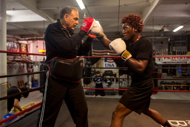 PORTLAND, ME - MAY 14: Bob Russo works with boxer Wade Faria, 22, of South Portland, at Portland Boxing Club in Portland on Tuesday, May 14, 2019. Russo was named president of Golden Gloves of America. (Staff photo by Brianna Soukup/Staff Photographer)