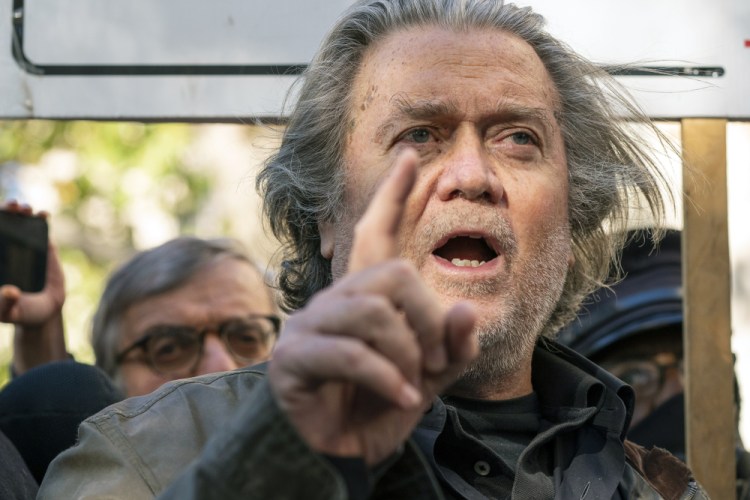 Former White House strategist Steve Bannon pauses to speak with reporters after leaving federal court on Monday in Washington.  