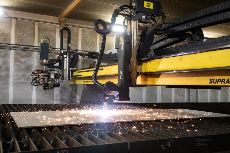 A burning machine at General Dynamics Bath Iron Works’ Structural Fabrication Facility in Brunswick cuts the first steel for the future USS Quentin Walsh.