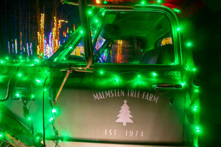 A truck lit in green, at the Winter Wonderland display at Augusta West Kampground in Winthrop.
