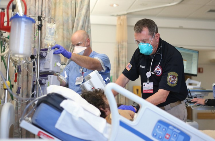 U.S. Department of Health and Human Services Disaster Medical Assistance Team members treat a patient at Maine Medical Center in December. 