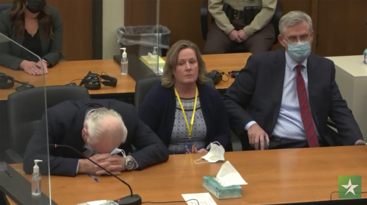 In this screen grab from video, former Brooklyn Center Police Officer Kim Potter center, with defense attorney Earl Gray, left, and Paul Engh sit at the defense table after the verdict is read Thursday at the Hennepin County Courthouse in Minneapolis, Minn. 