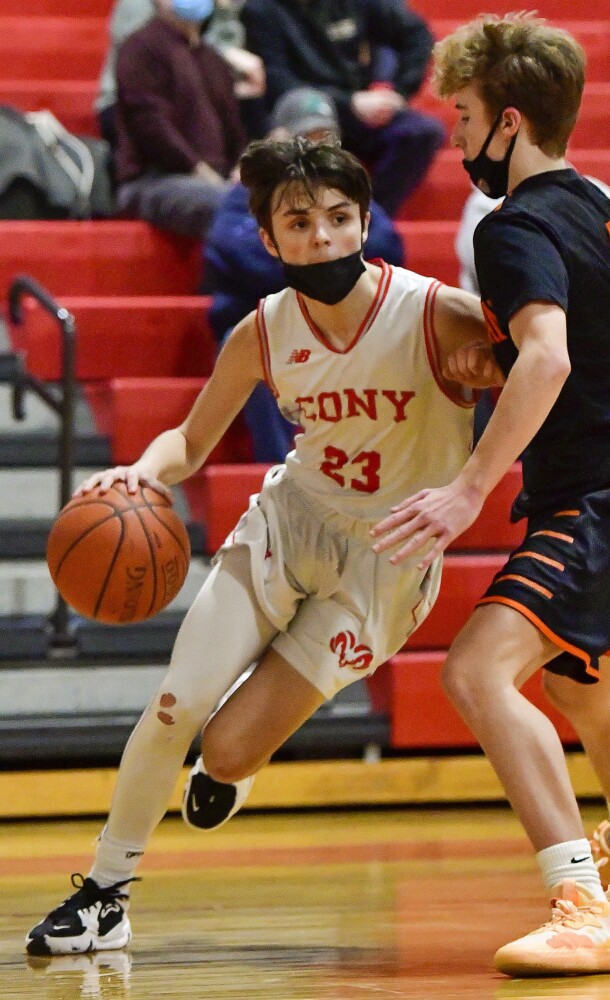 AUGUSTA, ME - JANUARY 12: ConyÕs Eli Parise, left, tries to get around SkowheganÕs Brayden Saucier during a basketball game Wednesday January 12, 2022 in the Ryan Family Gym at Cony Middle and High School in Augusta. (Staff photo by Joe Phelan/Staff Photographer)