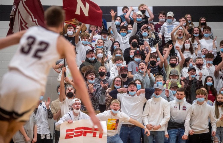 The Nokomis student section erupts after a monster dunk by Cooper Flagg (32) against Brewer during a boys basketball game Thursday in Newport.