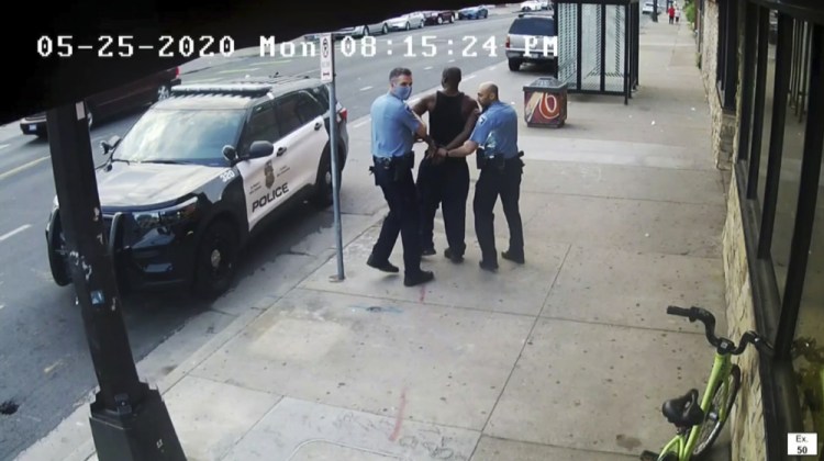 This image from video shows Minneapolis police officers Thomas Lane, left, and J. Alexander Kueng  escorting George Floyd to a police vehicle outside Cup Foods in Minneapolis, on May 25, 2020. Three former Minneapolis officers are on trial this week on federal civil rights charges in the death of Floyd. 